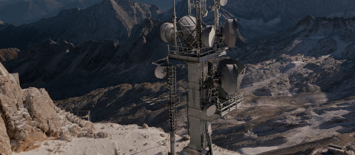 A satellite communication tower on a snowy mountain peak, with vast mountain ranges in the background under a clear sky.